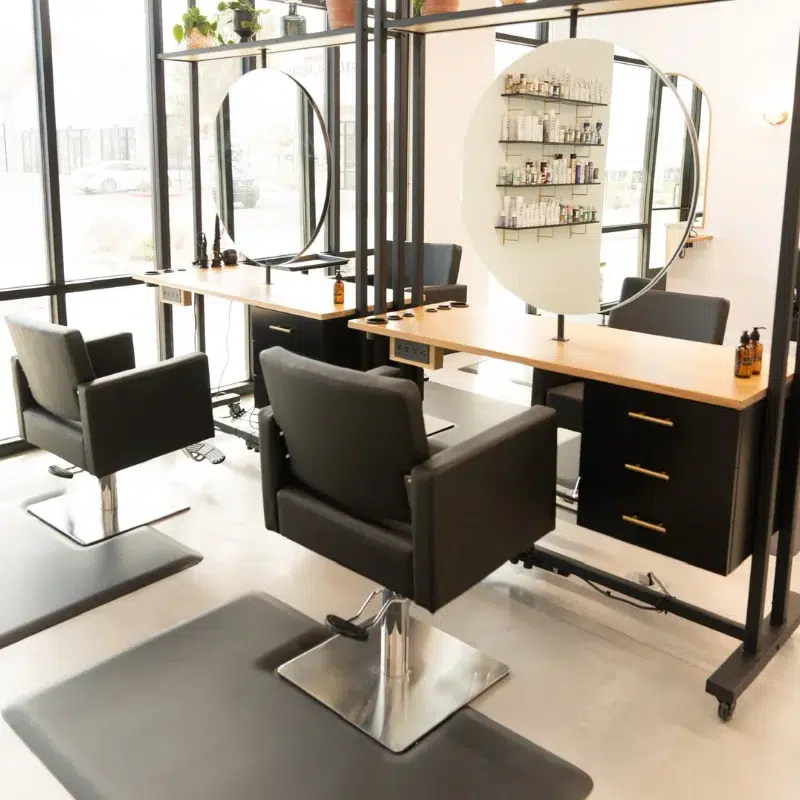 Modern salon setup showing styling chairs and workstation layout – Salon Chair Buying Guide