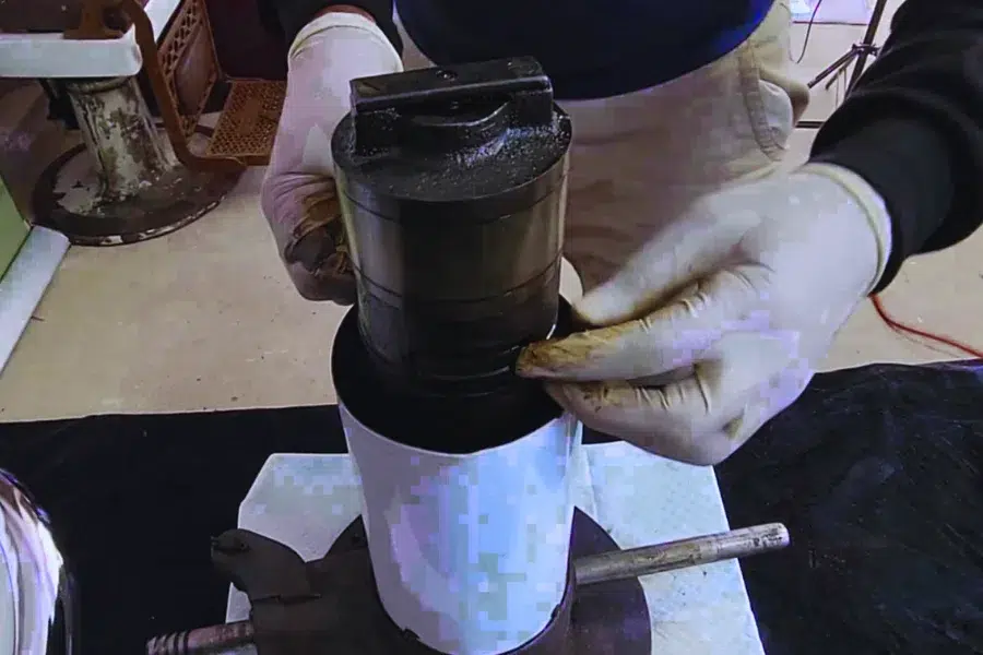 Disassembling barber chair hydraulic pump for inspection and repair