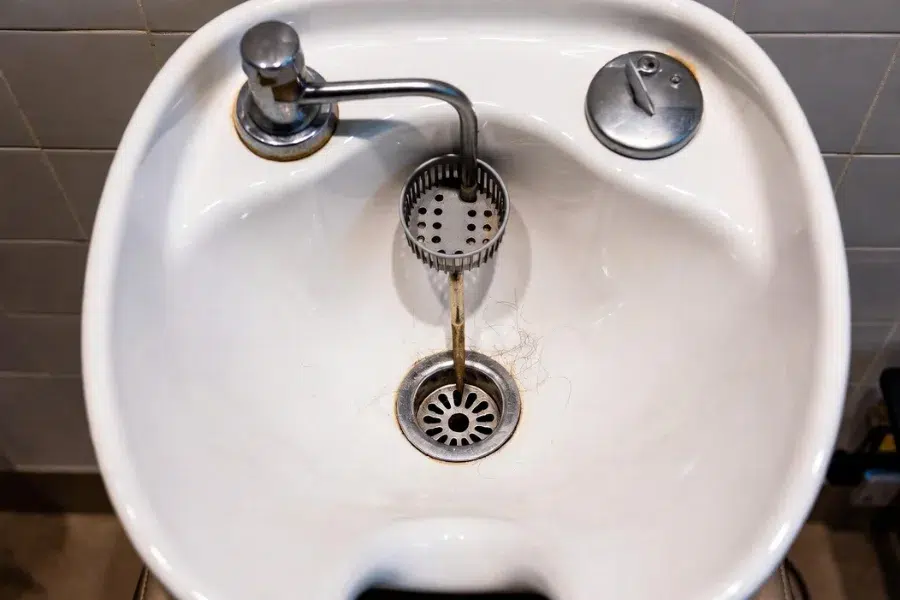 Drain maintenance example from Tips for Cleaning and Maintaining Salon Shampoo Bowls