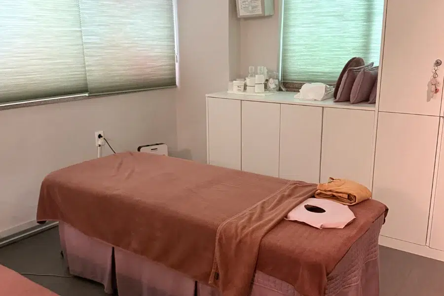 essential medical spa equipment setup with treatment bed and laser device