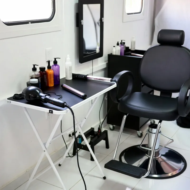 “Set up a mobile salon with portable salon equipment, featuring a well-organized mobile beauty station.
