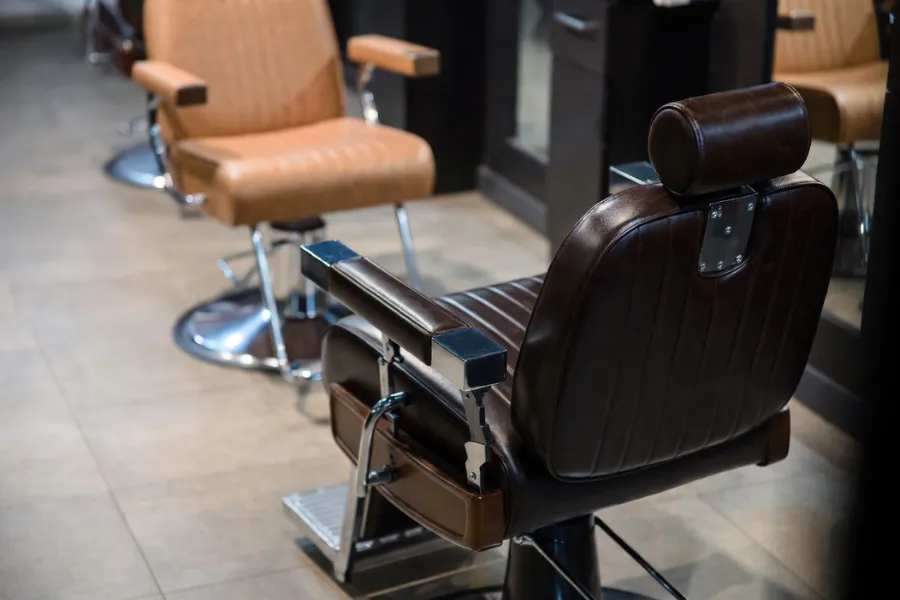 Barber Chair vs Salon Chair: Recline Function Comparison, showcasing the reclining feature of a barber chair