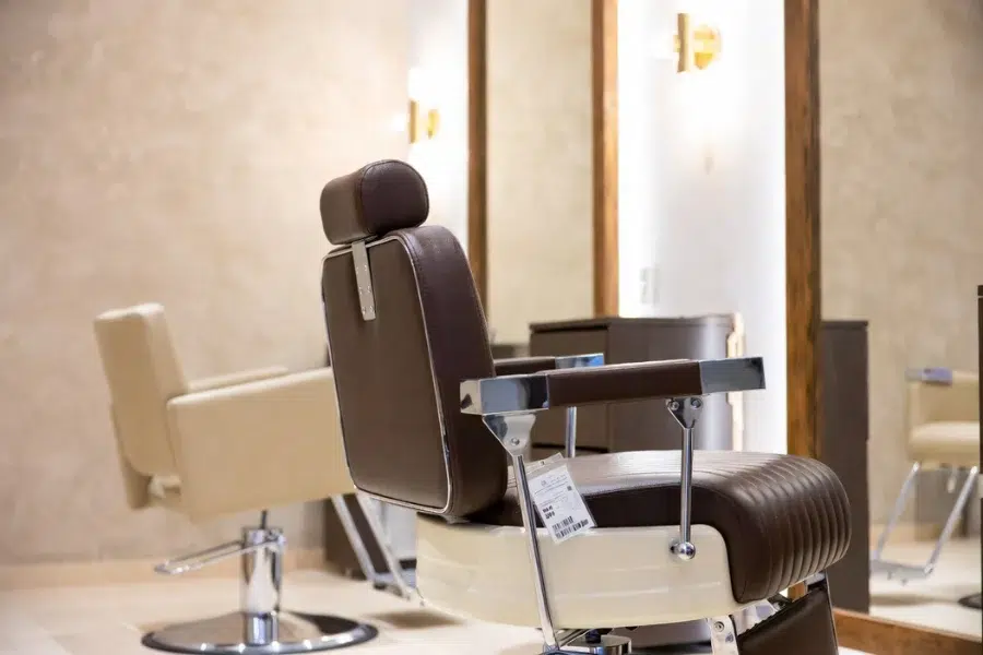 Minimalist modern luxury salon design with refined materials and cohesive color scheme, enhancing your beauty business experience.
