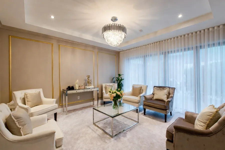Elegant waiting area with designer seating, luxury beverages, and upscale ambiance to create a memorable salon experience.