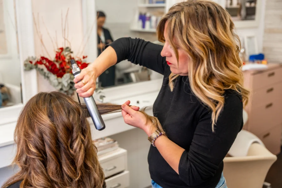 busy salon environment with multiple clients, stylists working efficiently using adjustable salon chairs, professional and clean setup