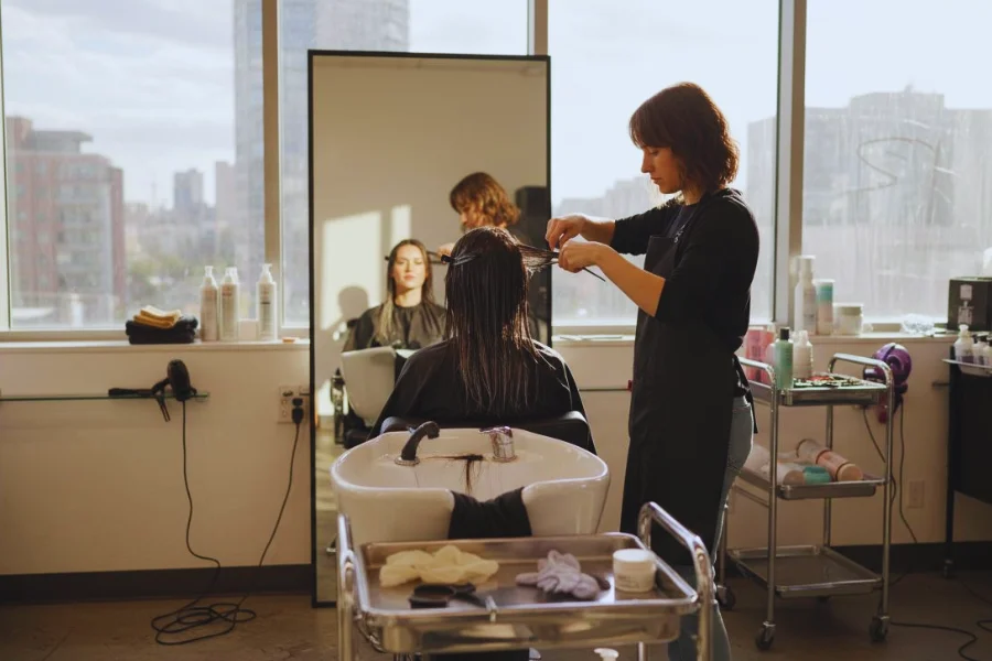 
keratin hair treatment in professional salon environment with stylist and client