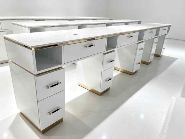 Luxury white manicure table with marble countertop and gold trim, multi-drawer nail salon station