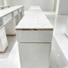 Luxury white manicure table with marble countertop and gold trim, multi-drawer nail salon station