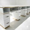 Luxury white manicure table with marble countertop and gold trim, multi-drawer nail salon station