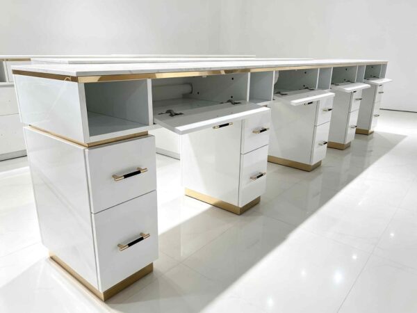 Luxury white manicure table with marble countertop and gold trim, multi-drawer nail salon station