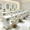 Luxury white manicure table with marble countertop and gold trim, multi-drawer nail salon station